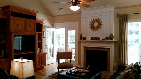 5435 Brandy Bay Road Raleigh, NC 27613 - Photo 10 of 25 Vaulted Ceiling w/custom trimmed fireplace with lots of mill work, ceiling fan w/light, custom paint, blinds, french doors to sunroom, hardwoods, wired for surround sound Living Room