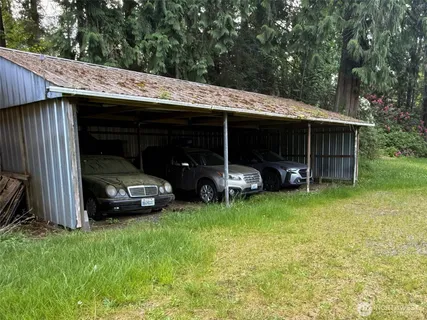 a view of a car parked in front of a house