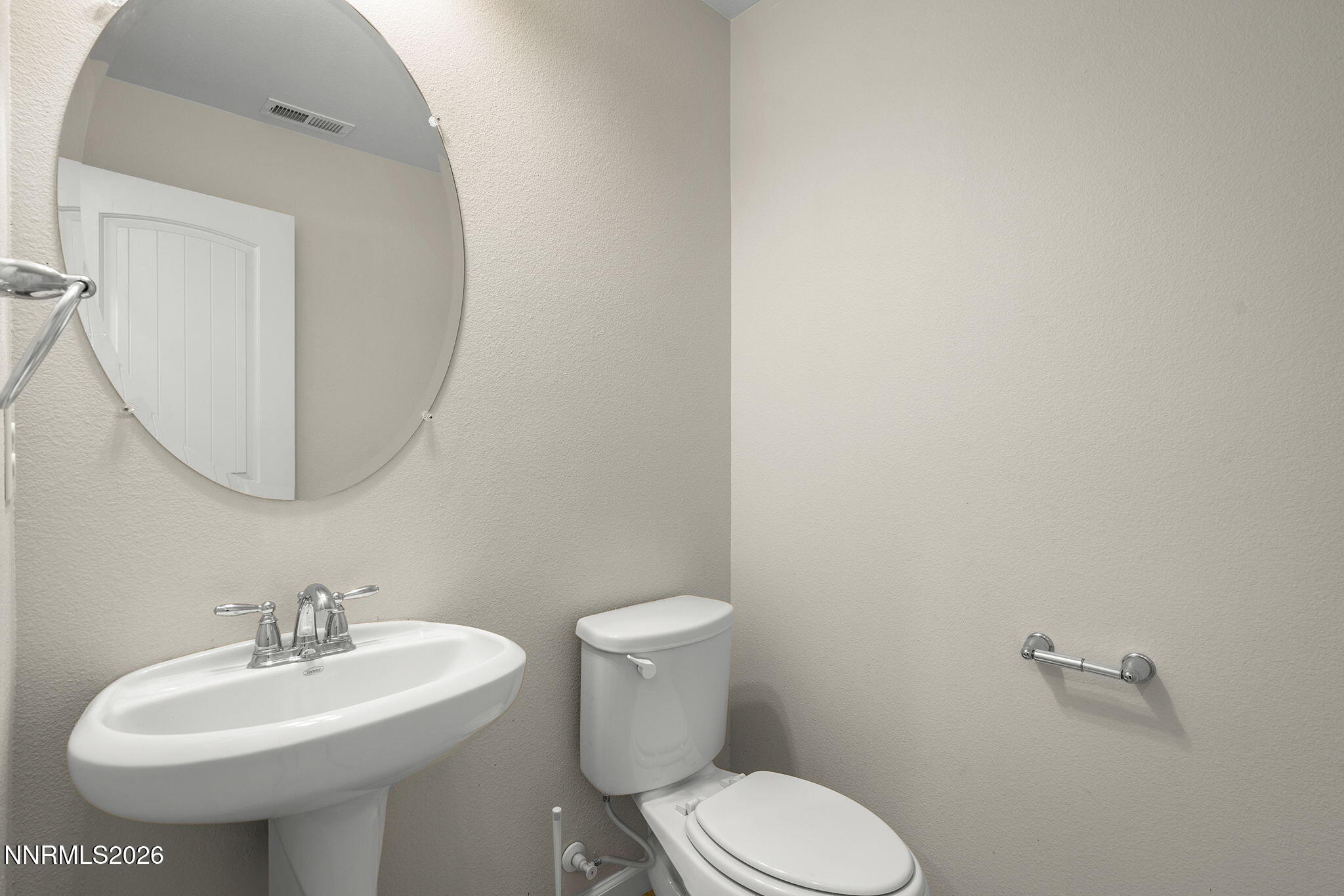 2490 Eastshore Place, Unit 104 Reno, NV 89509 - Photo 11 of 29 a bathroom with a sink a toilet and mirror