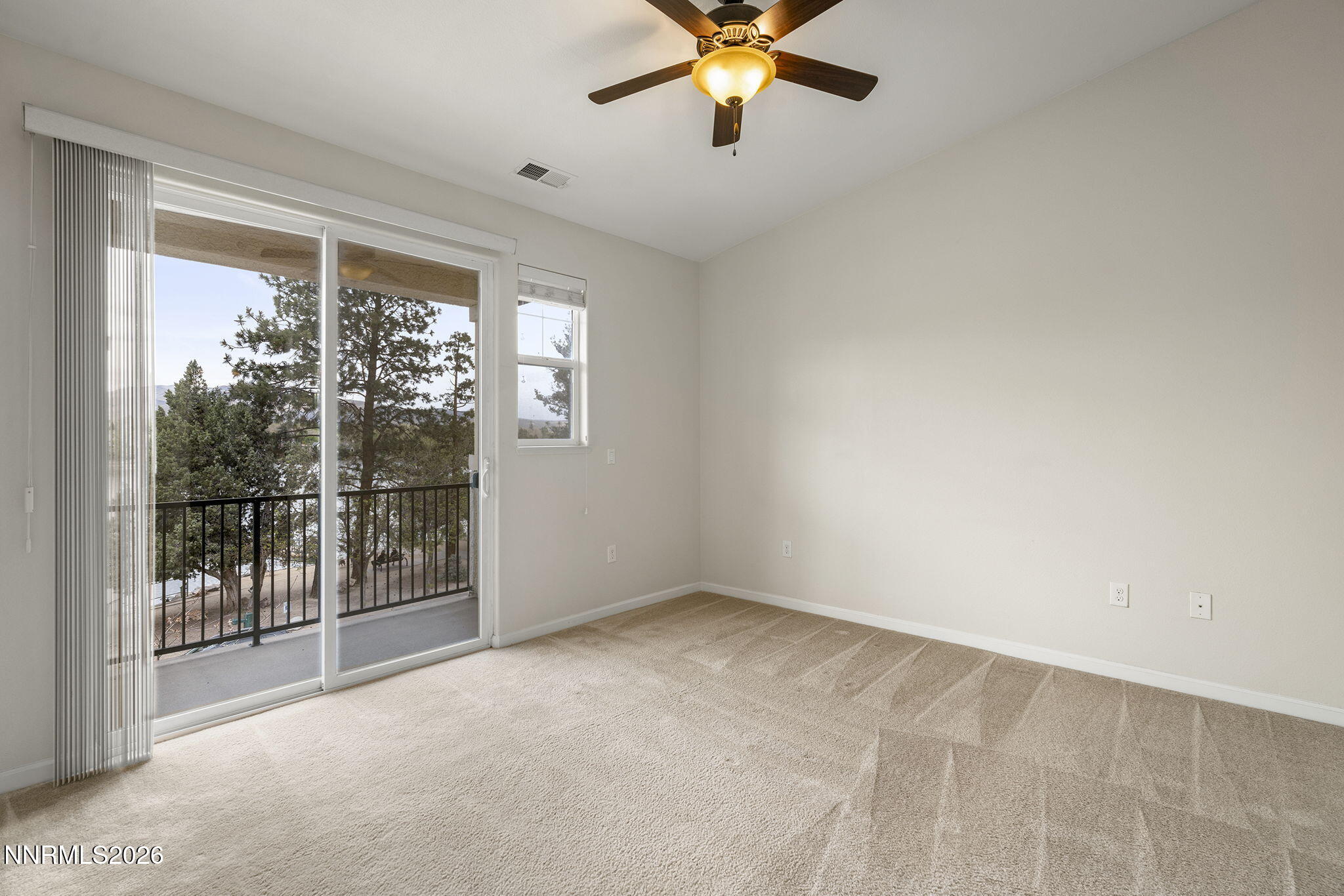 2490 Eastshore Place, Unit 104 Reno, NV 89509 - Photo 12 of 29 a view of a livingroom with a ceiling fan and window