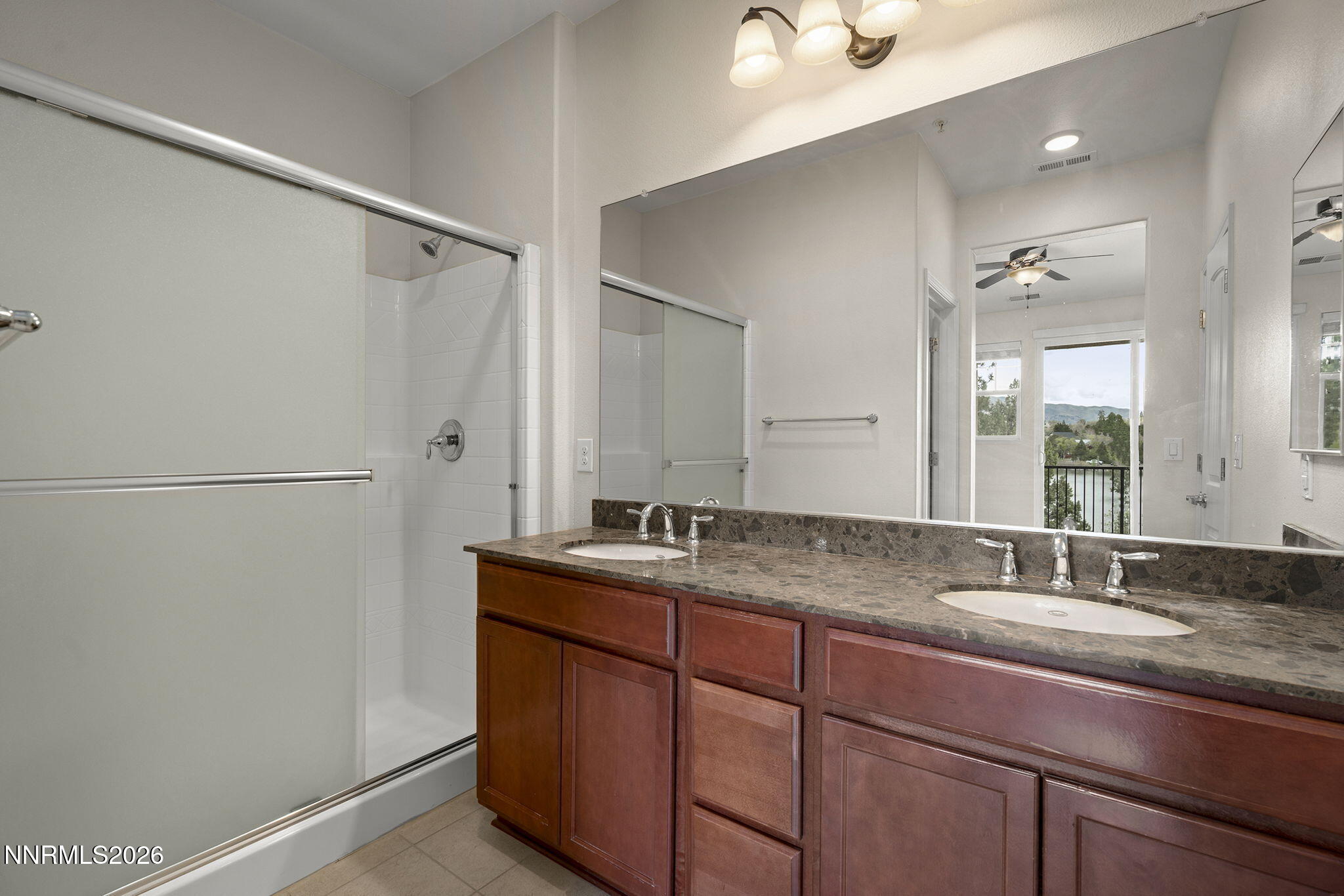 2490 Eastshore Place, Unit 104 Reno, NV 89509 - Photo 15 of 29 a bathroom with a granite countertop sink mirror and double