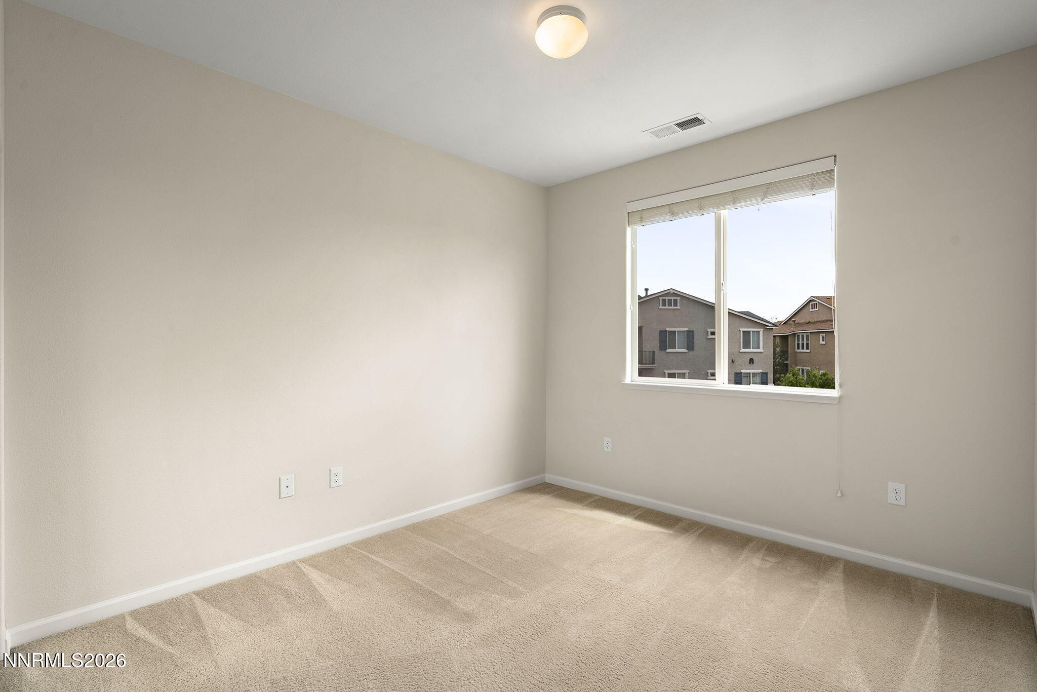 2490 Eastshore Place, Unit 104 Reno, NV 89509 - Photo 16 of 29 an empty room with a window