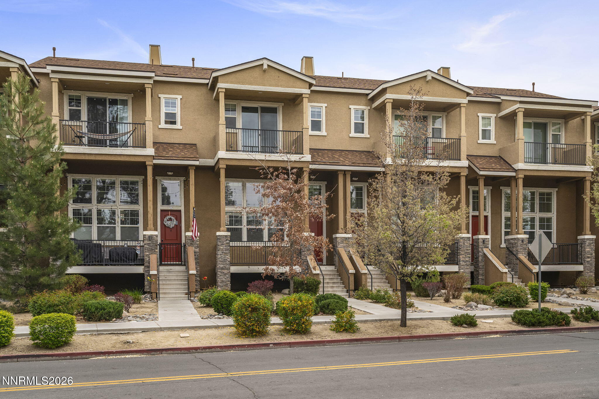 2490 Eastshore Place, Unit 104 Reno, NV 89509 - Photo 2 of 29 a front view of a house with a yard