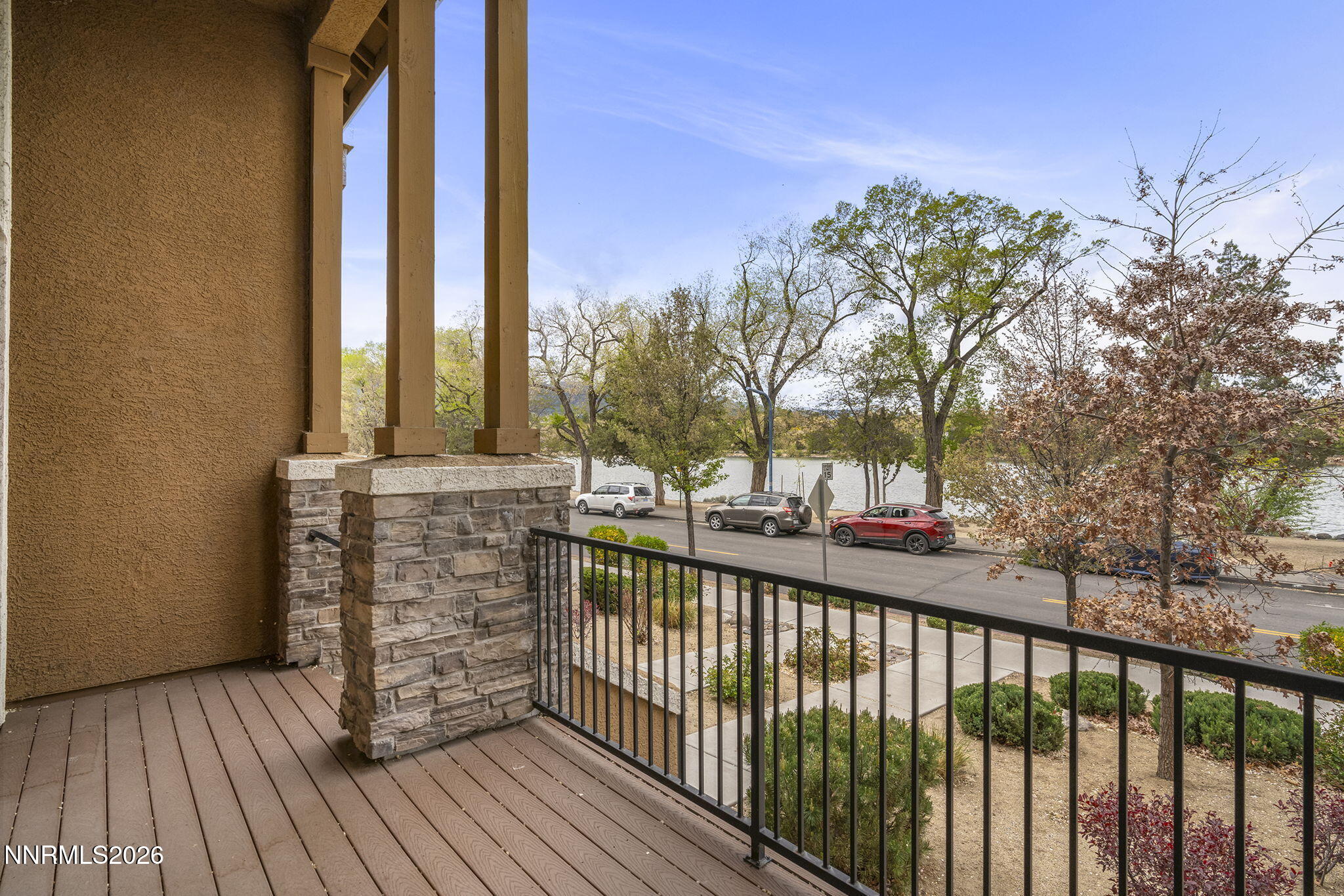 2490 Eastshore Place, Unit 104 Reno, NV 89509 - Photo 21 of 29 a view of a balcony with wooden floor and fence