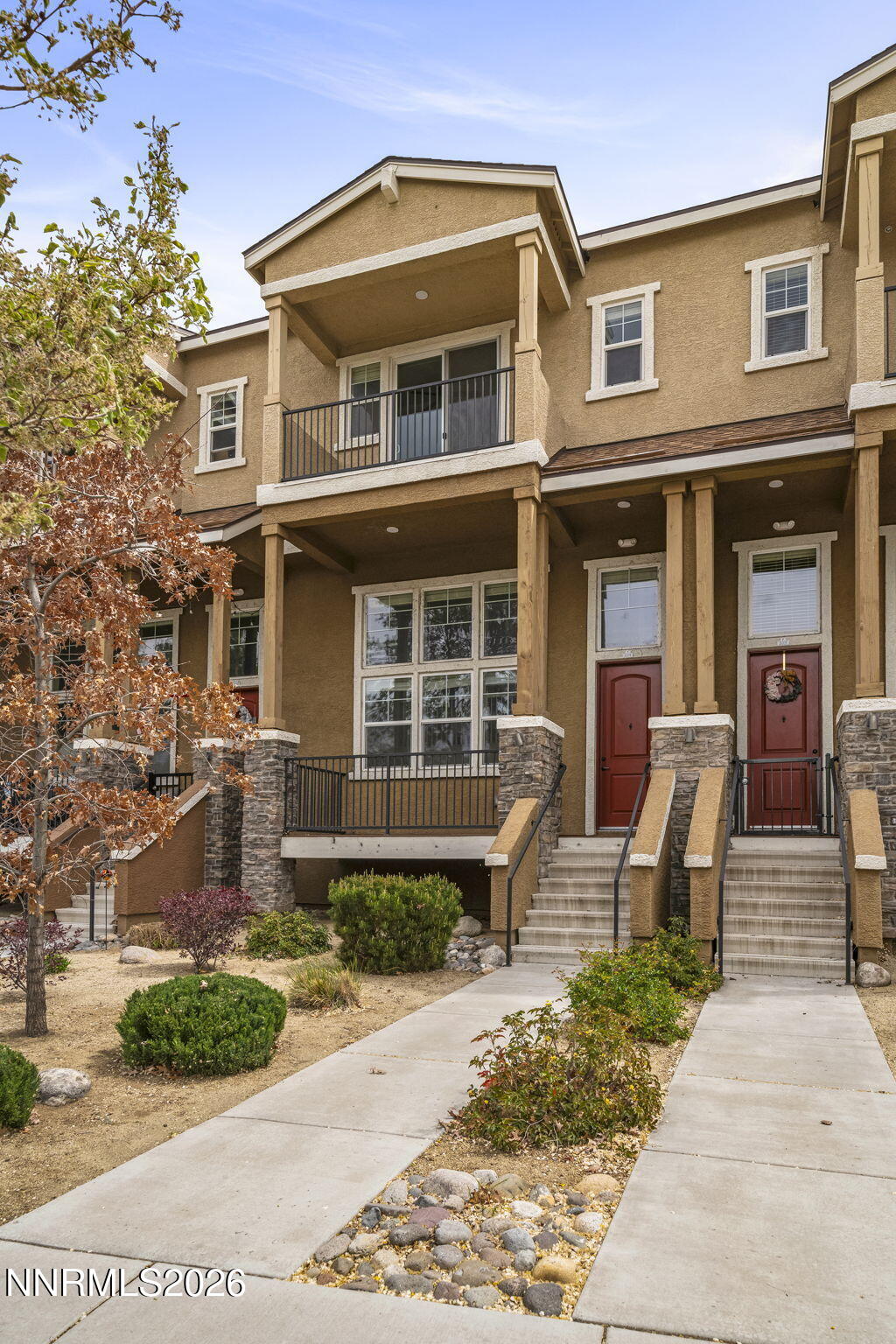 2490 Eastshore Place, Unit 104 Reno, NV 89509 - Photo 3 of 29 a front view of a house with garden