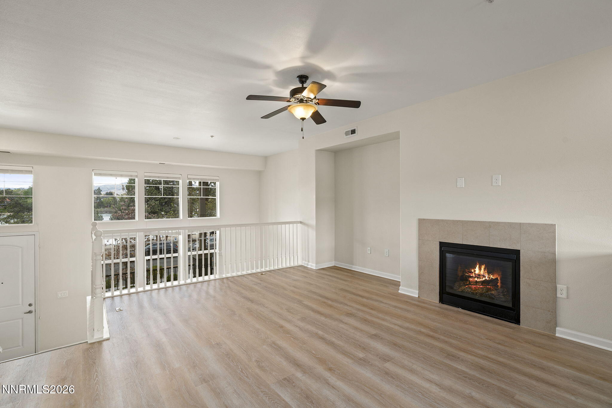 2490 Eastshore Place, Unit 104 Reno, NV 89509 - Photo 7 of 29 a view of empty room with wooden floor and fan