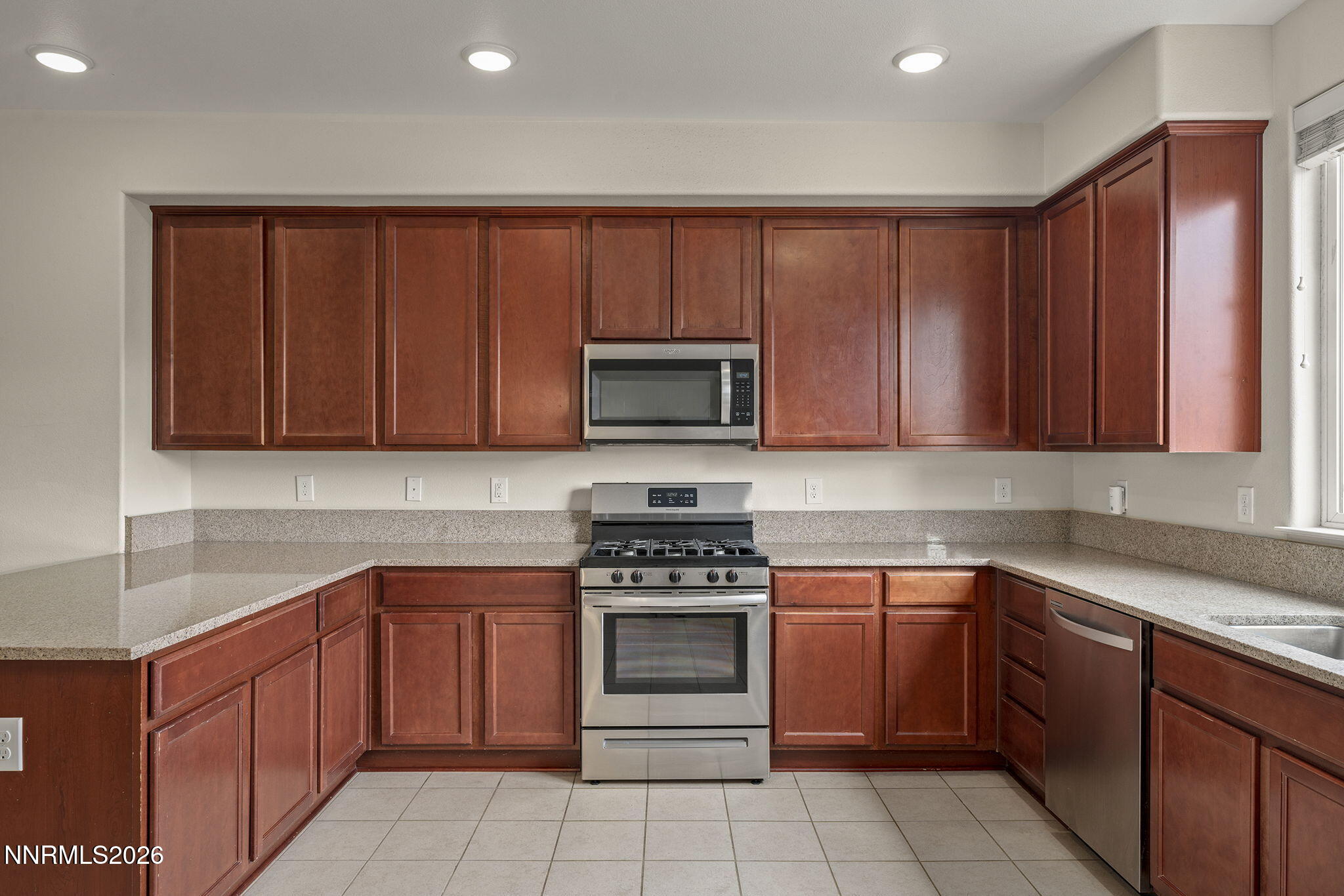 2490 Eastshore Place, Unit 104 Reno, NV 89509 - Photo 10 of 29 a kitchen with a sink stove and microwave