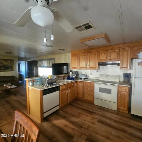 a kitchen with stainless steel appliances granite countertop a stove and a sink