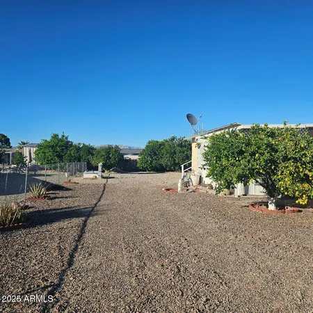 a view of a road with a building in the background