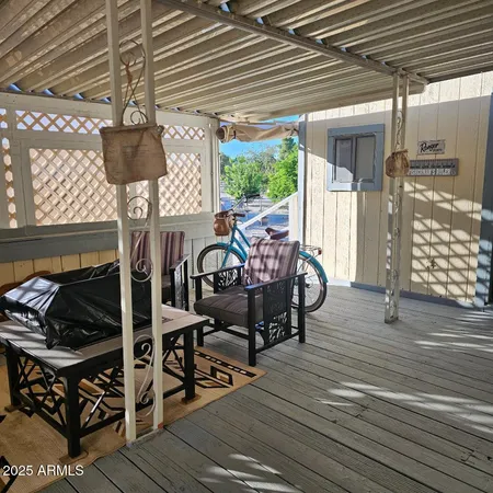 a view of a chairs and table in the patio