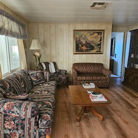 a living room with furniture a couch and a table