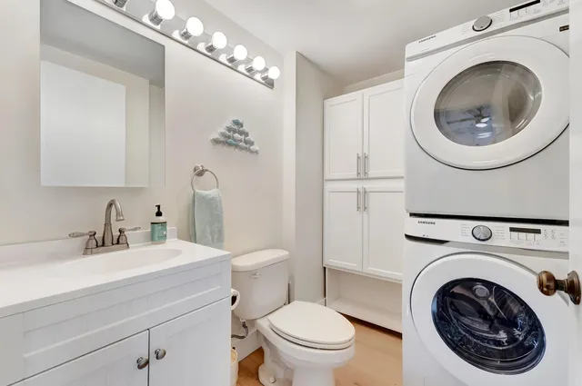a view of a hallway with bedroom and balcony