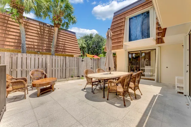 a view of a chairs and table in the patio