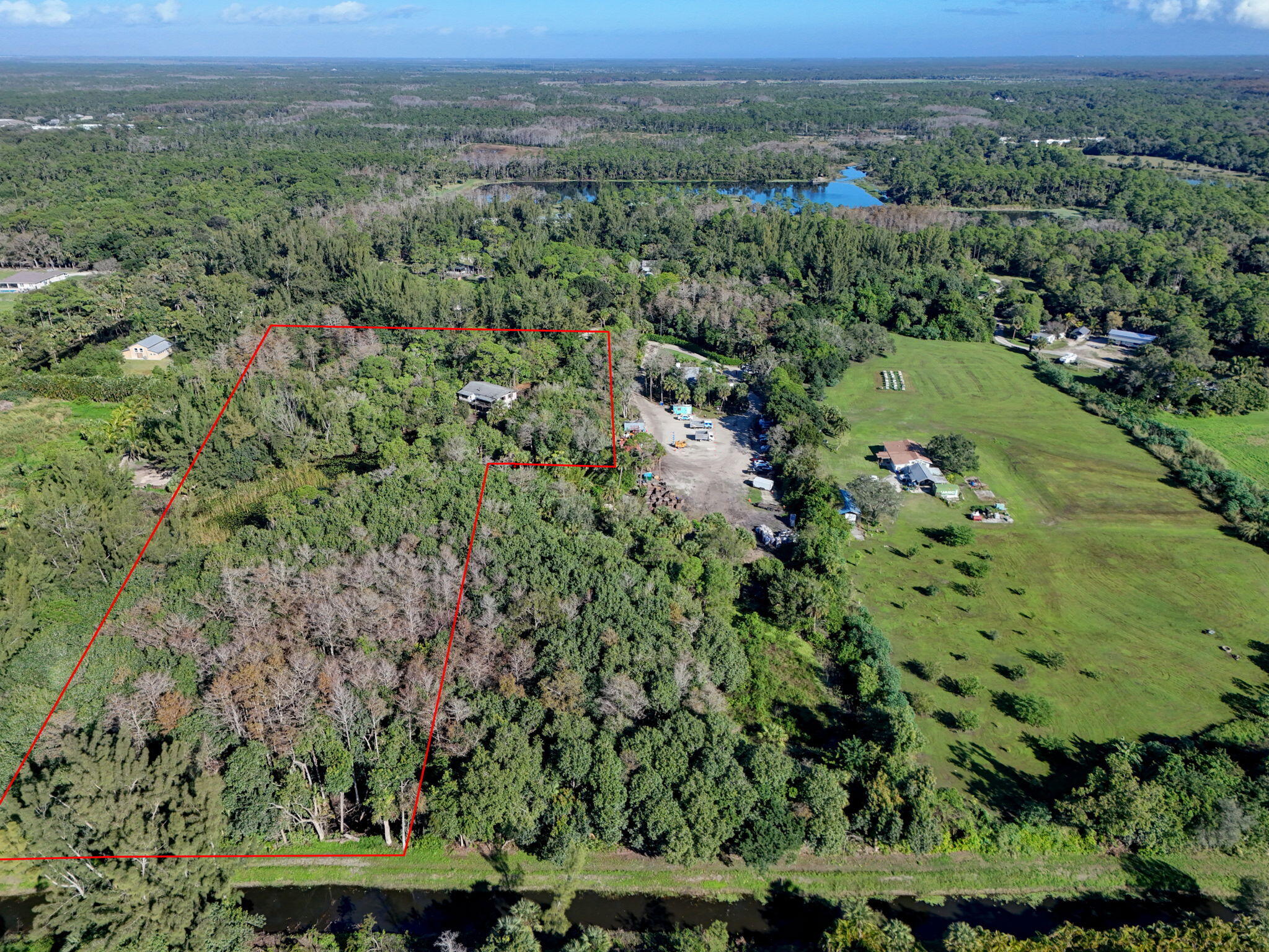 9620 171st Street North Jupiter, FL 33478 - Photo 1 of 23 an aerial view of a house with a yard