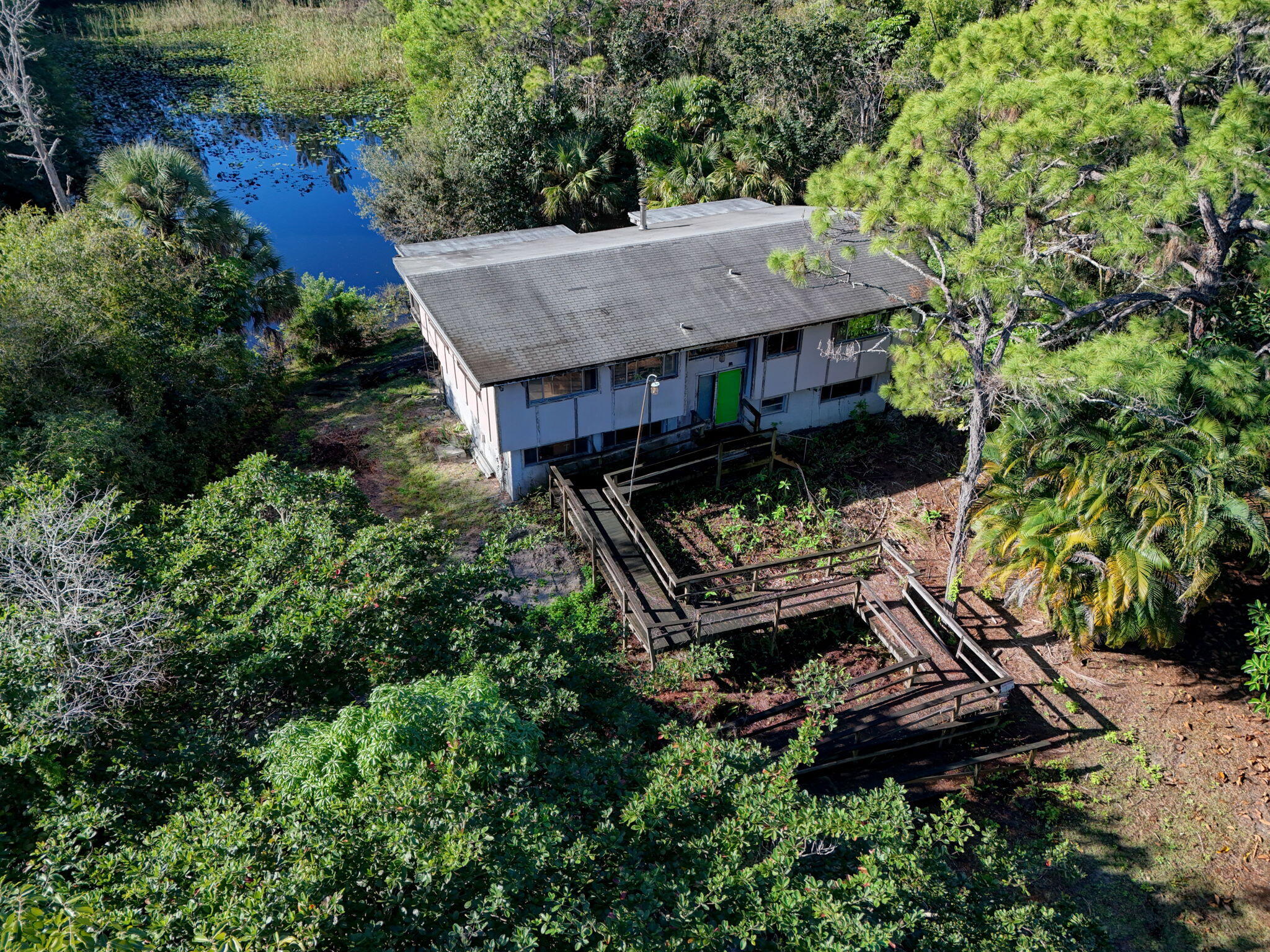 9620 171st Street North Jupiter, FL 33478 - Photo 15 of 23 an aerial view of a house with roof deck outdoor seating and yard