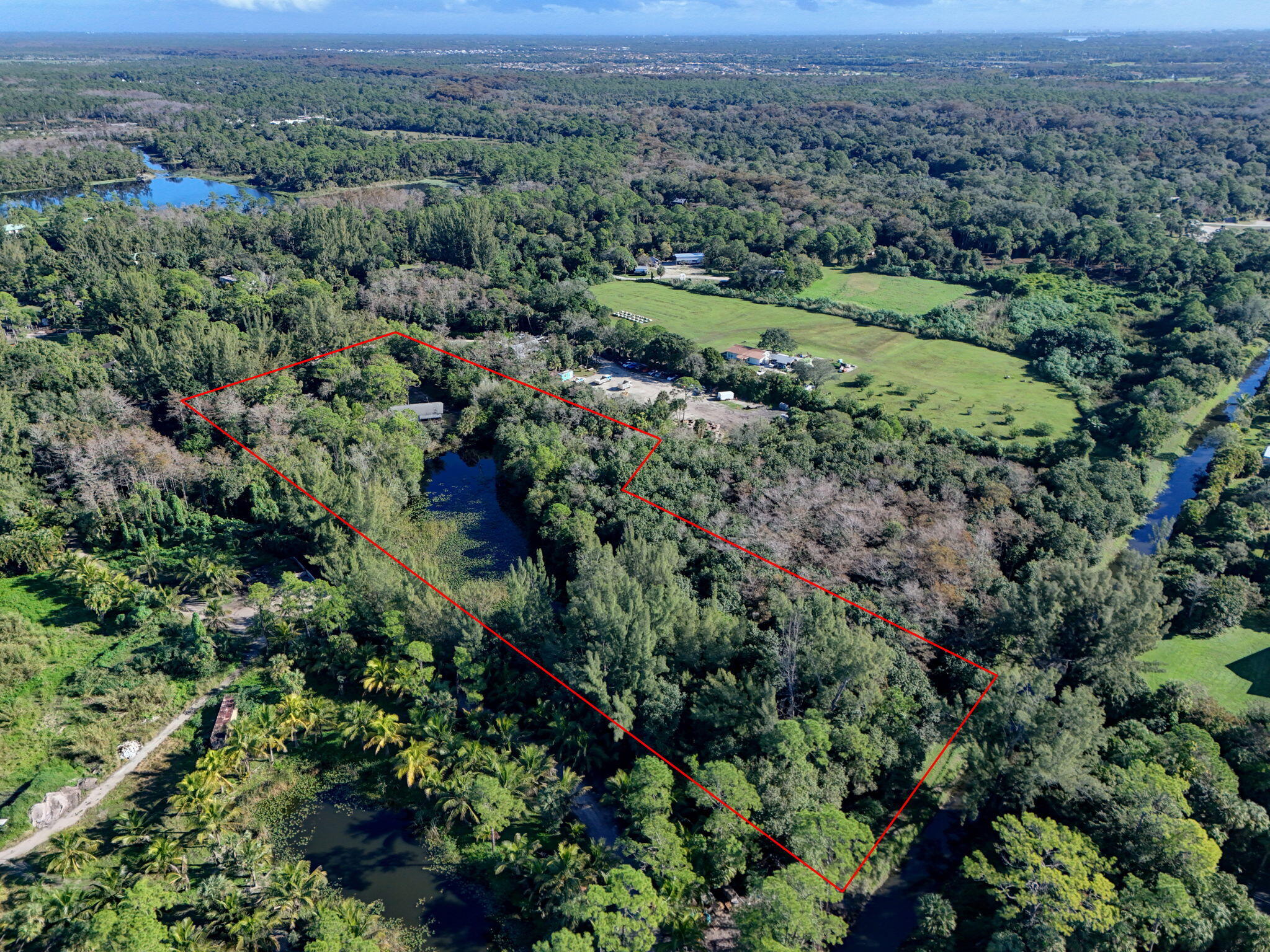 9620 171st Street North Jupiter, FL 33478 - Photo 2 of 23 an aerial view of forest
