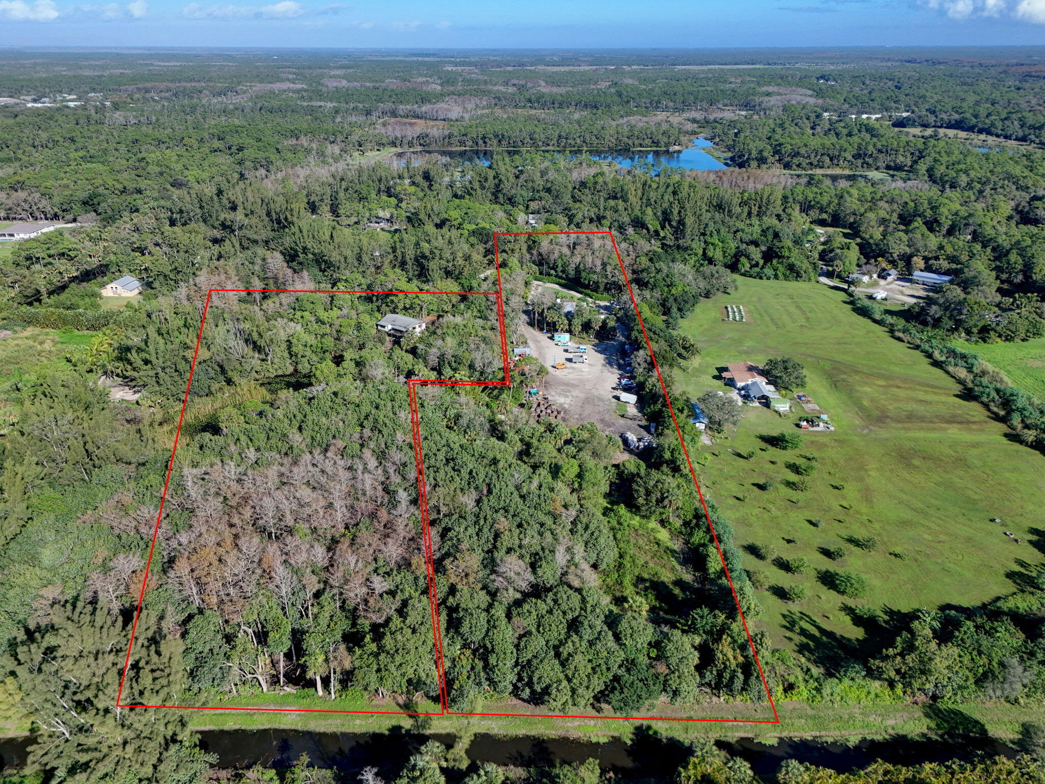 9620 171st Street North Jupiter, FL 33478 - Photo 6 of 23 an aerial view of a house with a yard