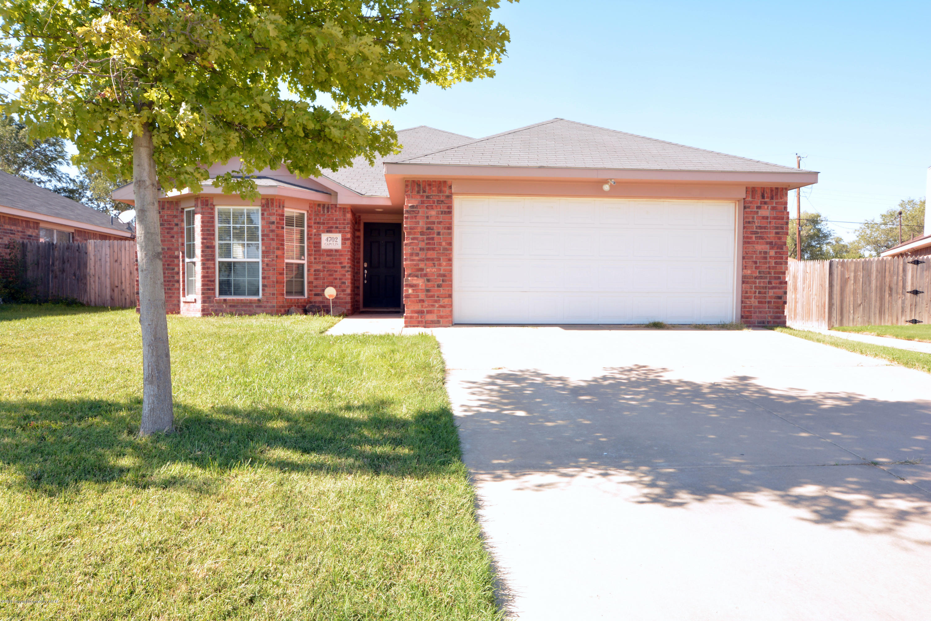 4702 Capulin Lane Amarillo, TX 79110 - Photo 1 of 24 a view of a house with backyard and a tree
