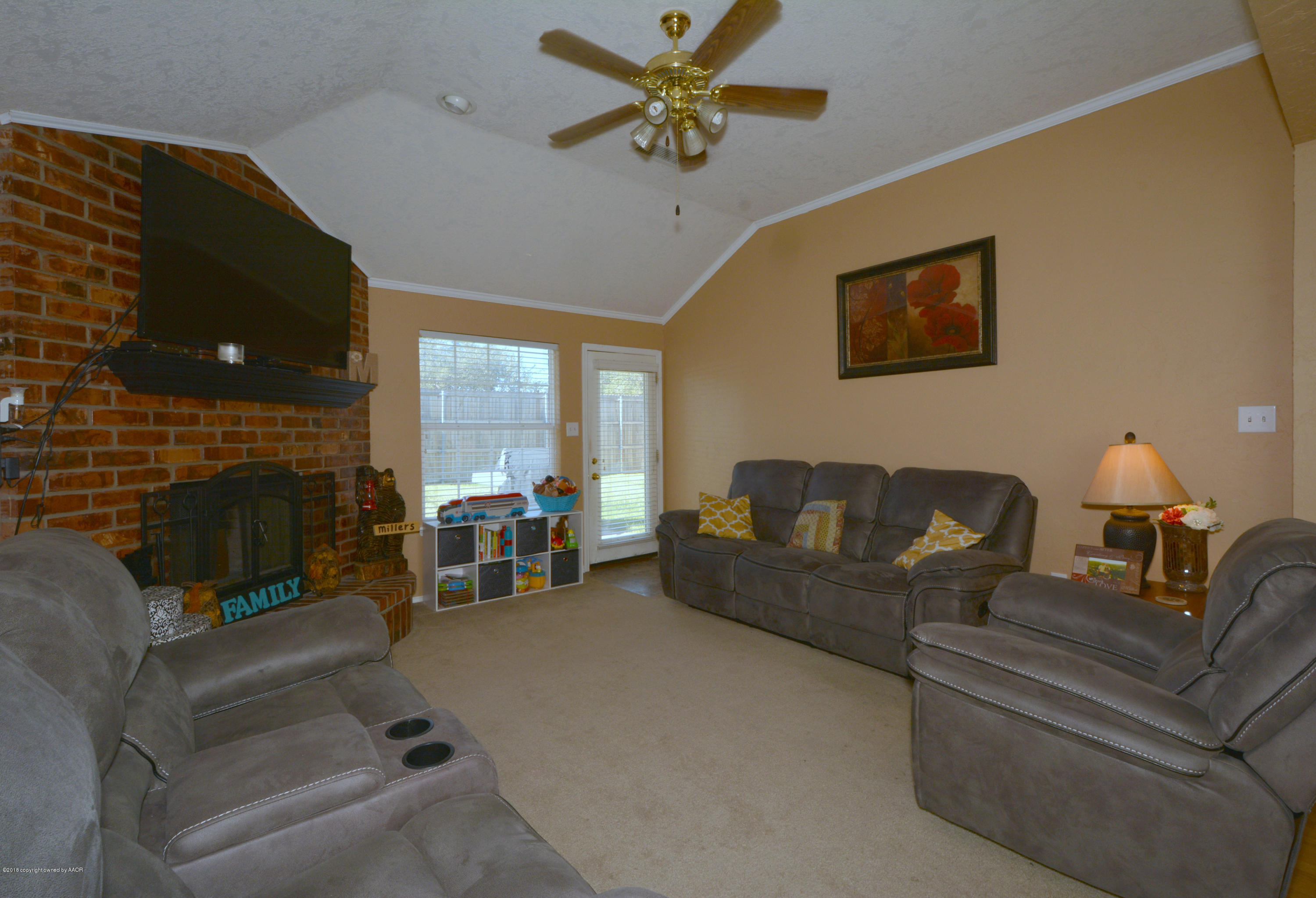 4702 Capulin Lane Amarillo, TX 79110 - Photo 3 of 24 a living room with furniture and a fireplace