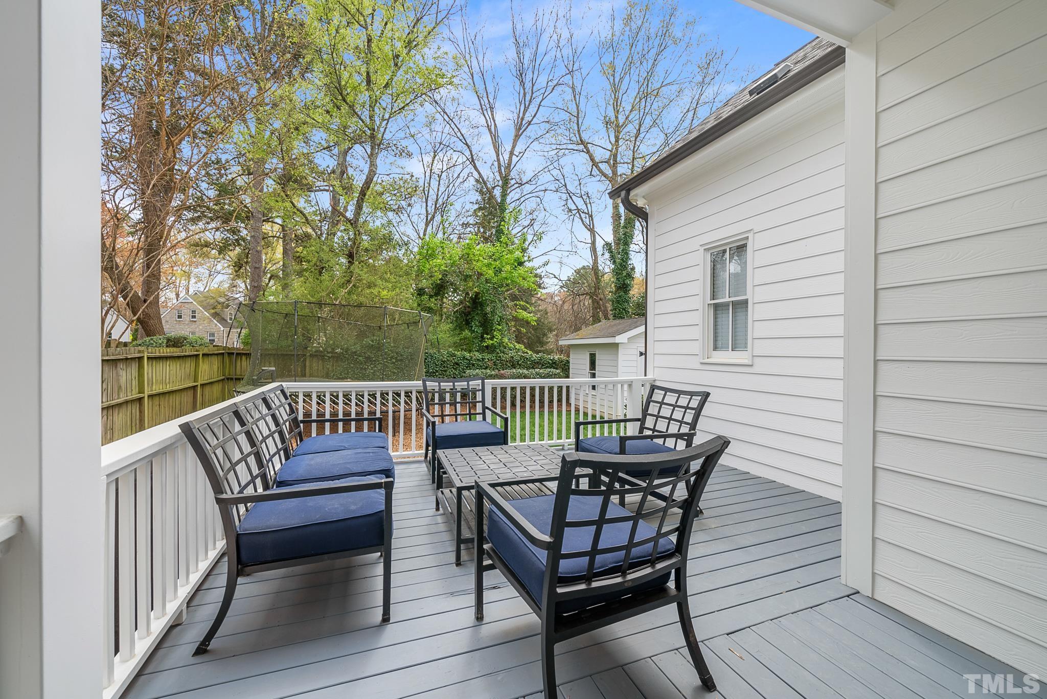 2615 Davis Street Raleigh, NC 27608 - Photo 12 of 55 a view of a chair and table on the deck