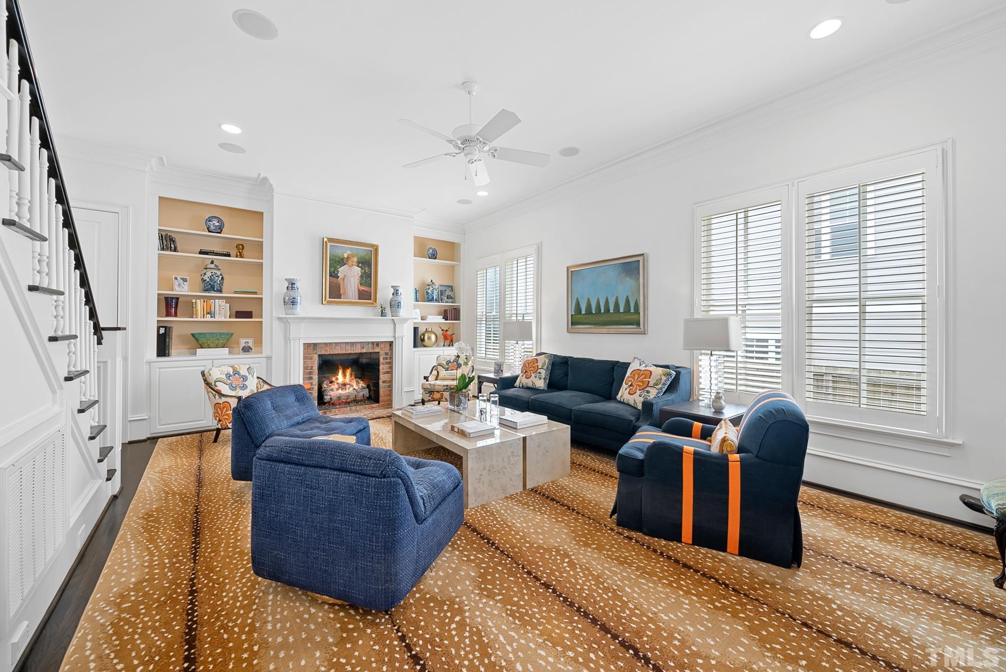 2615 Davis Street Raleigh, NC 27608 - Photo 19 of 55 a living room with furniture large window and a fireplace