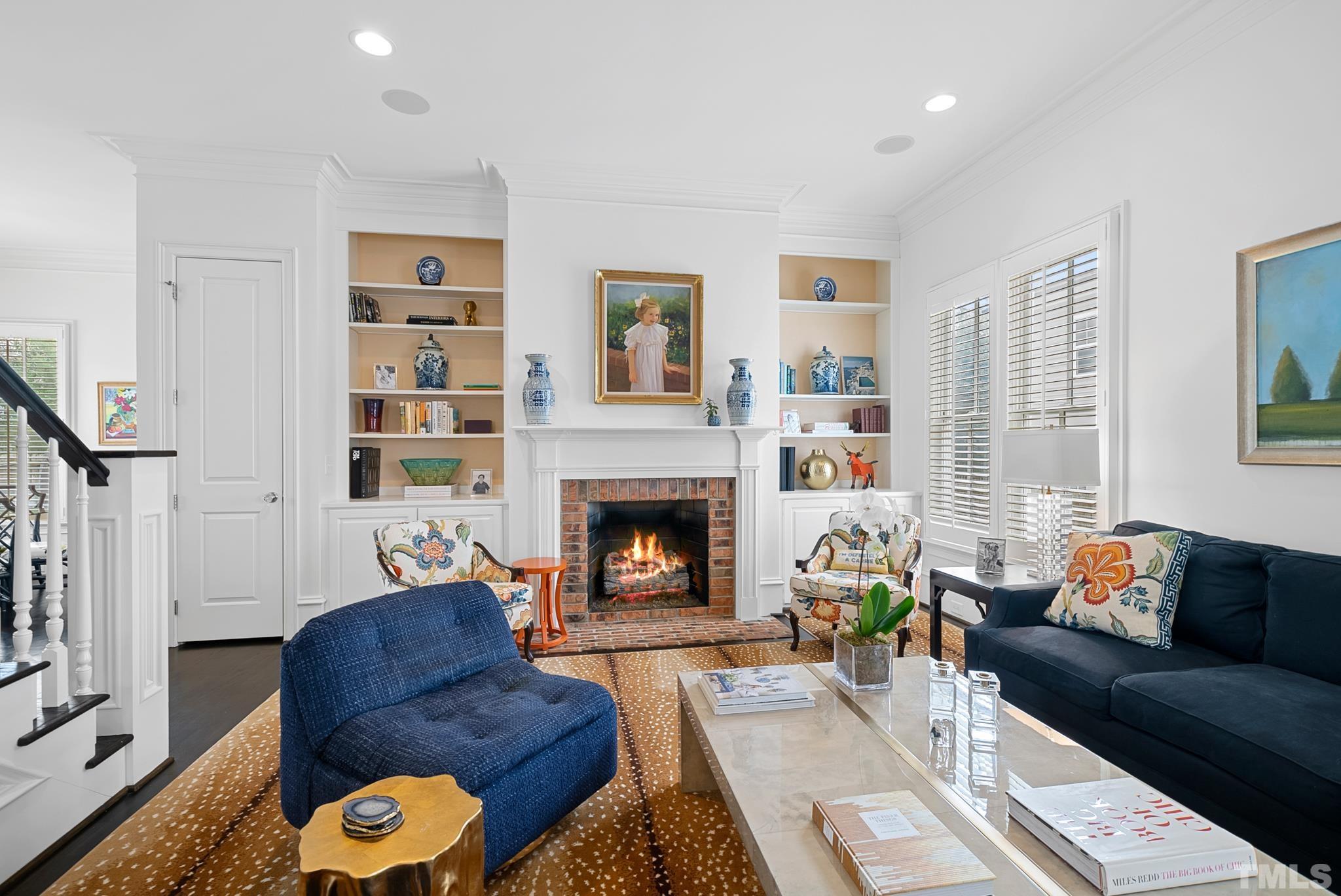 2615 Davis Street Raleigh, NC 27608 - Photo 21 of 55 a living room with furniture and a fireplace