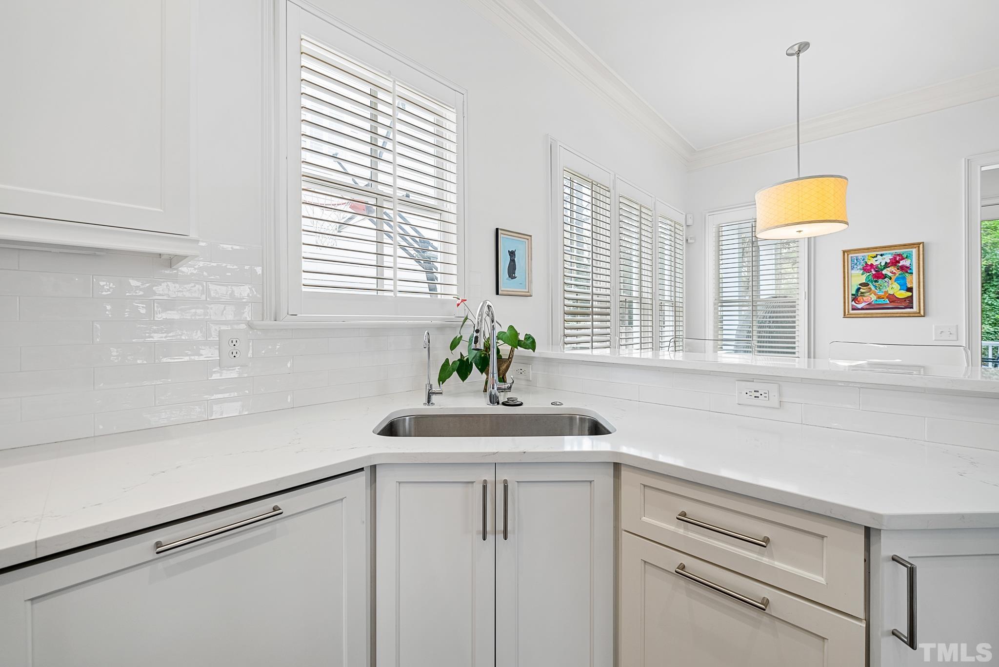 2615 Davis Street Raleigh, NC 27608 - Photo 25 of 55 a bathroom with a sink and a window