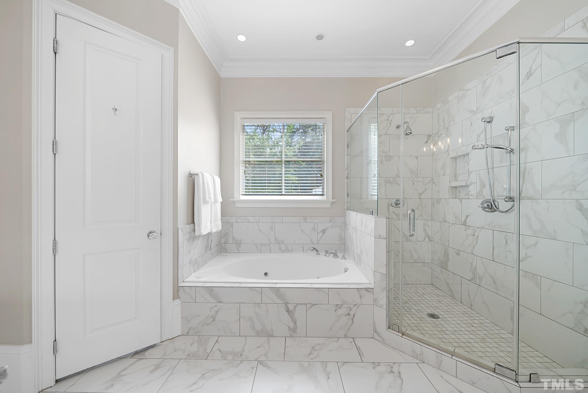 2615 Davis Street Raleigh, NC 27608 - Photo 32 of 55 a bathroom with a bathtub and shower