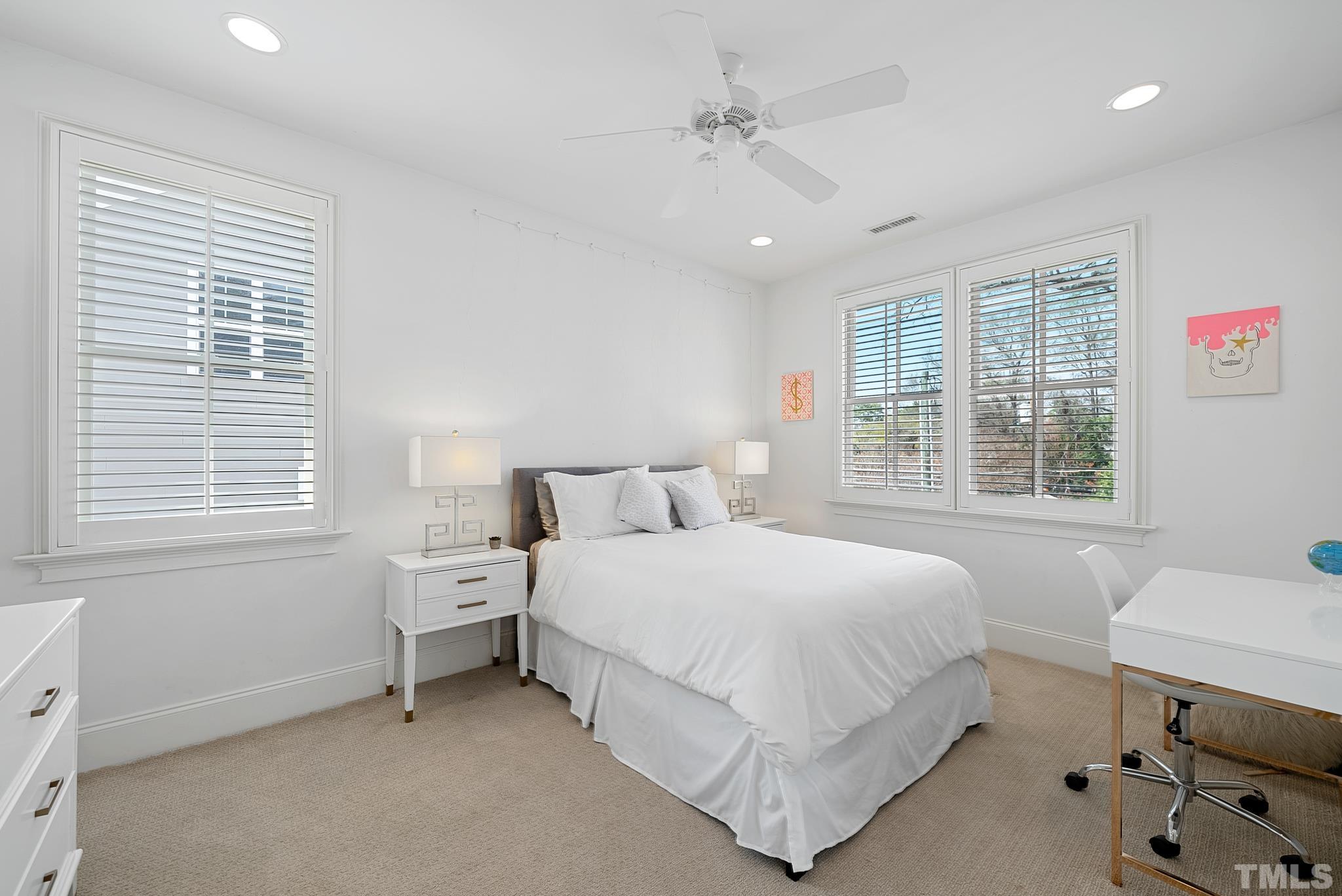 2615 Davis Street Raleigh, NC 27608 - Photo 38 of 55 a bedroom with a bed and a table in it