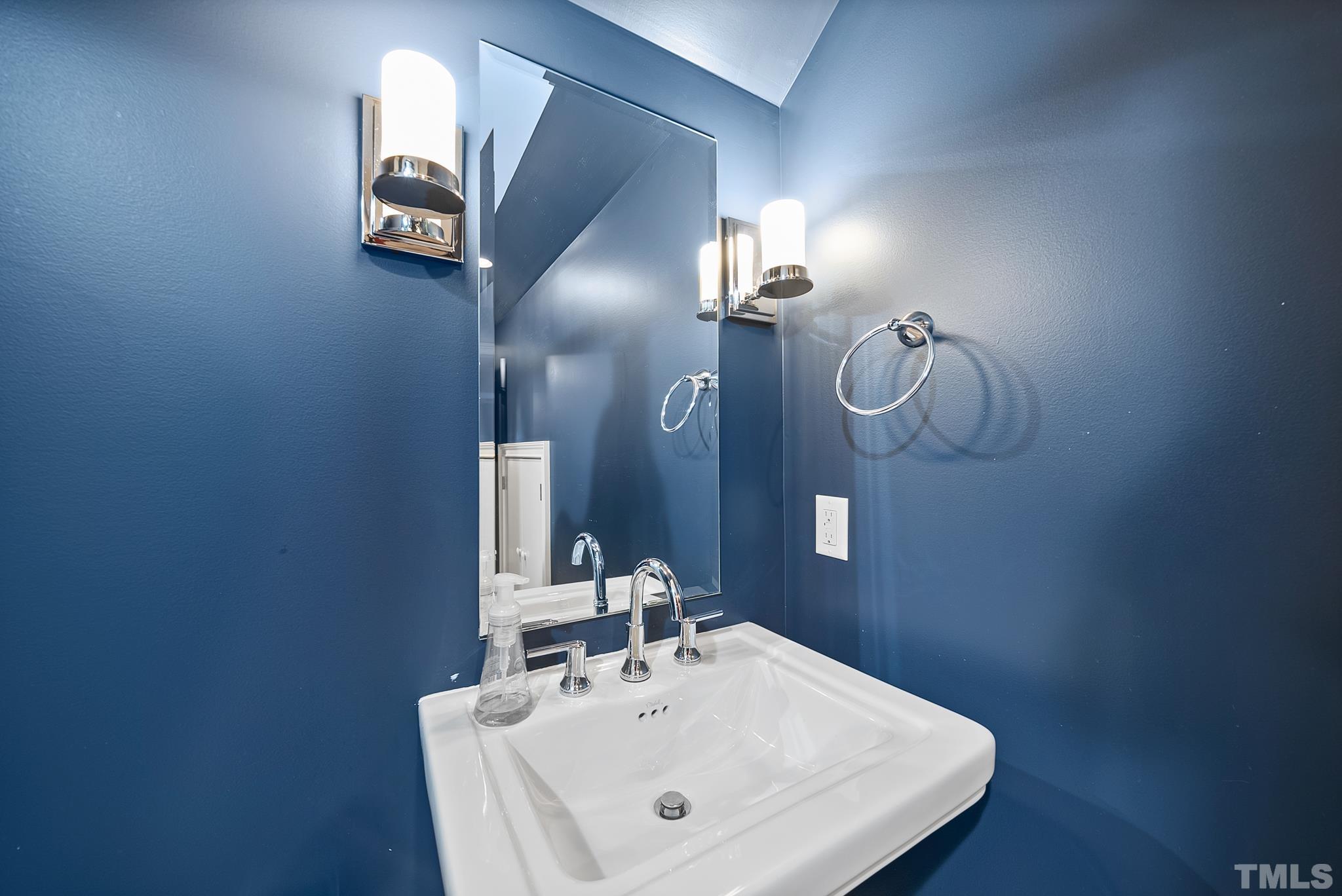 2615 Davis Street Raleigh, NC 27608 - Photo 50 of 55 a bathroom with a sink and a mirror