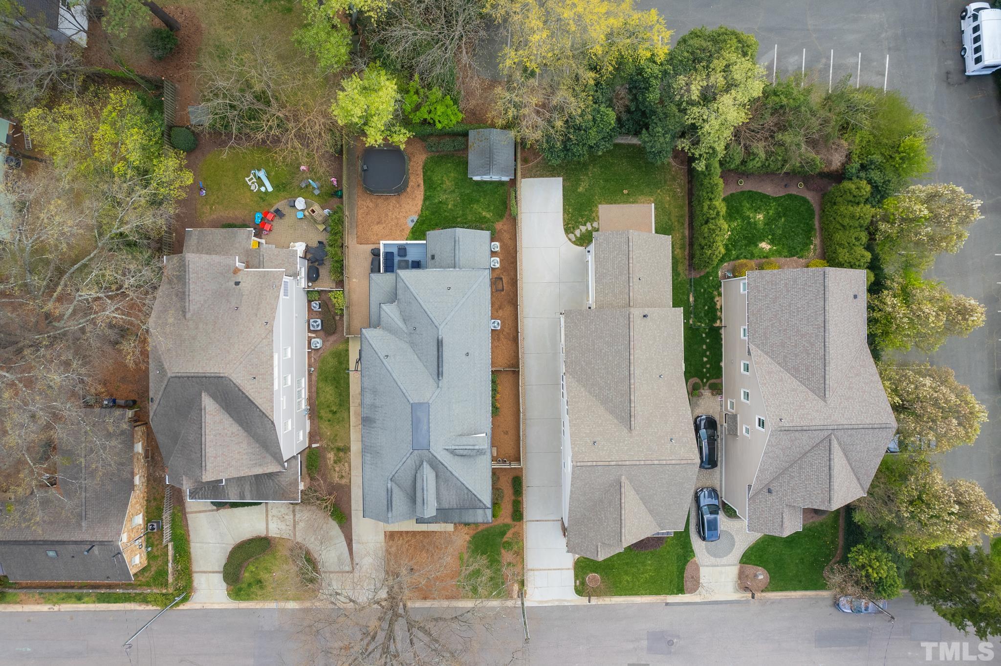 2615 Davis Street Raleigh, NC 27608 - Photo 5 of 55 an aerial view of a house with a yard and large tree