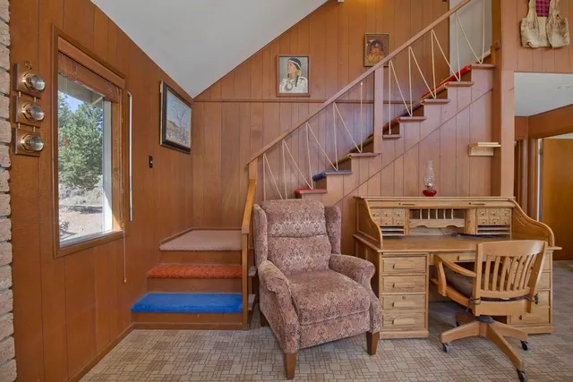 a view of entryway livingroom and hall with wooden floor