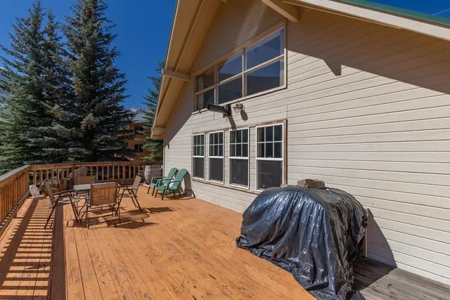 a view of balcony with wooden floor and outdoor seating