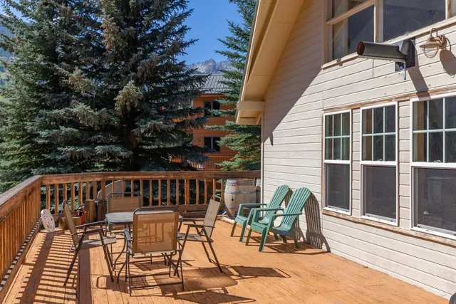 a view of a chairs and table in the balcony