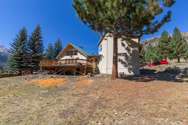 a house with trees in the background
