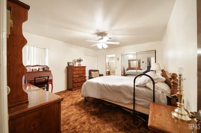 a bedroom with bed and window