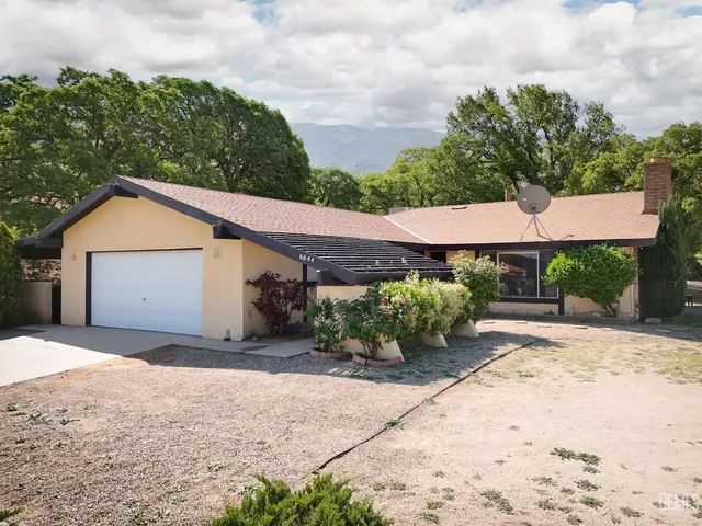 a backyard of a house with yard and barbeque oven
