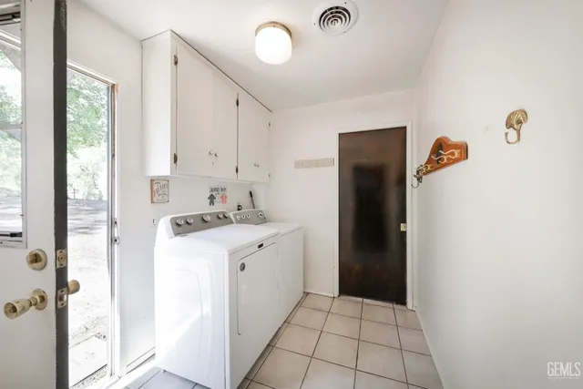 a kitchen with a refrigerator and a stove