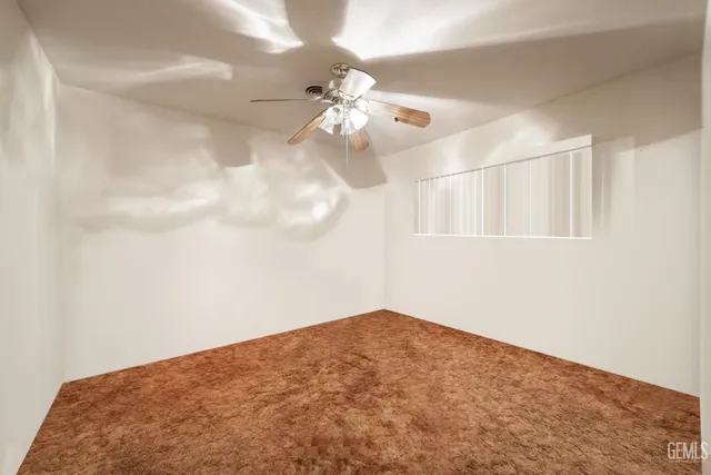 a view of a big room with carpet