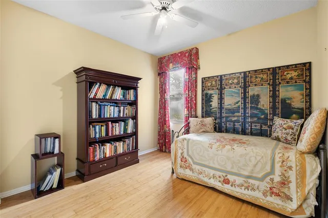 a bedroom with a bed and a table