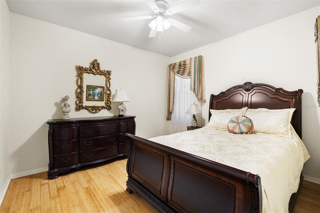 4906 Willow Ridge Terrace Valrico, FL 33596 - Photo 32 of 67 a bedroom with a bed and a dresser