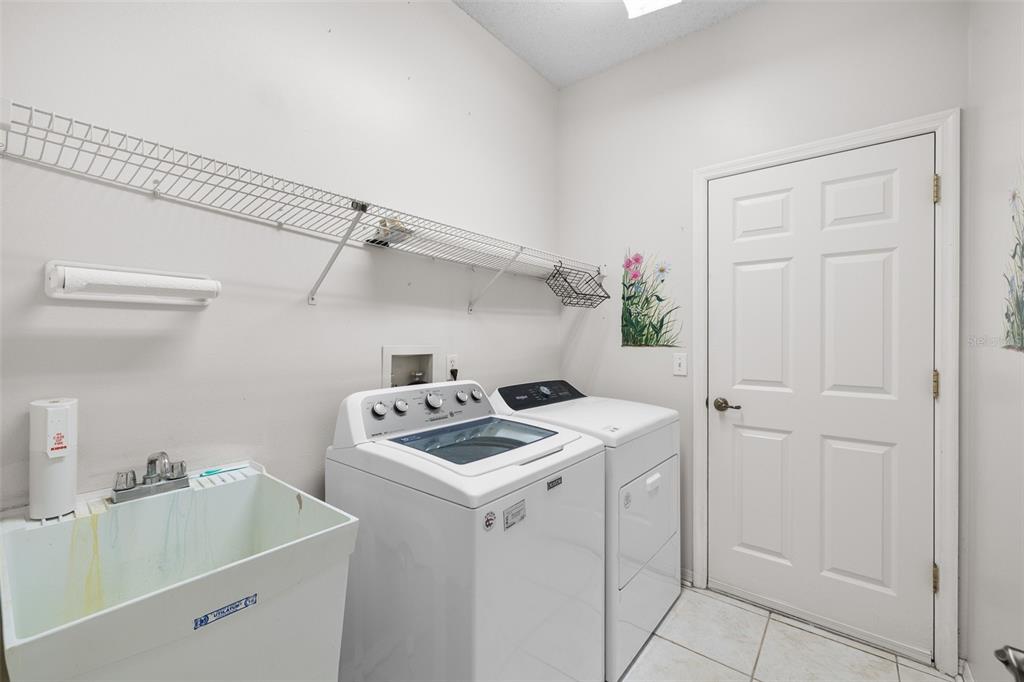 4906 Willow Ridge Terrace Valrico, FL 33596 - Photo 41 of 67 a utility room with sink dryer and washer