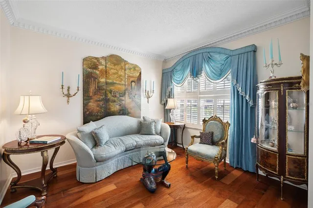 a living room with furniture rug and a window