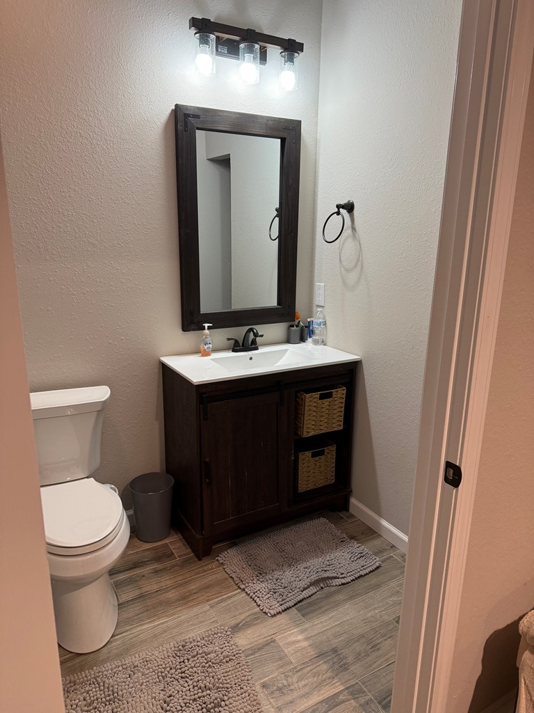 3530 Grape Creek Road Murphy, NC 28906 - Photo 21 of 53 a bathroom with a toilet sink and mirror