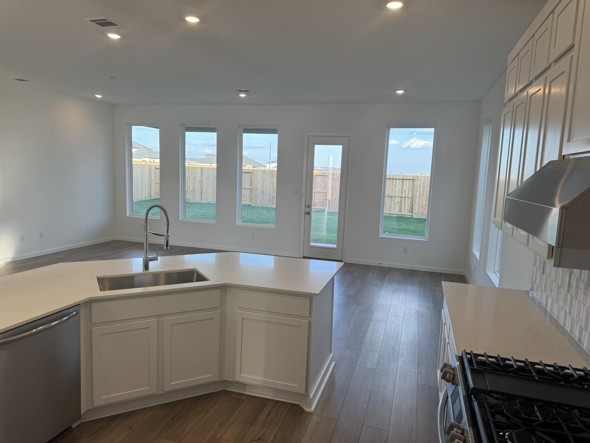 2719 Grove Crest Drive Rosenberg, TX 77469 - Photo 4 of 14 a kitchen with sink and mirror