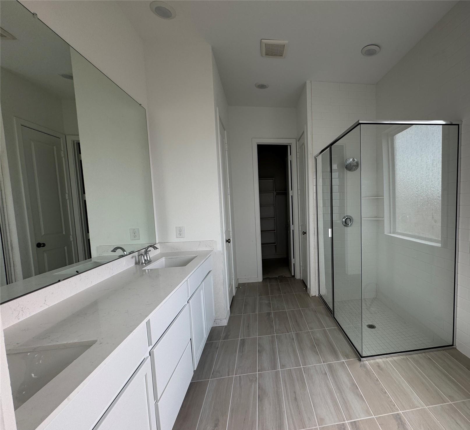 2719 Grove Crest Drive Rosenberg, TX 77469 - Photo 7 of 14 a bathroom with a double vanity sink and mirror