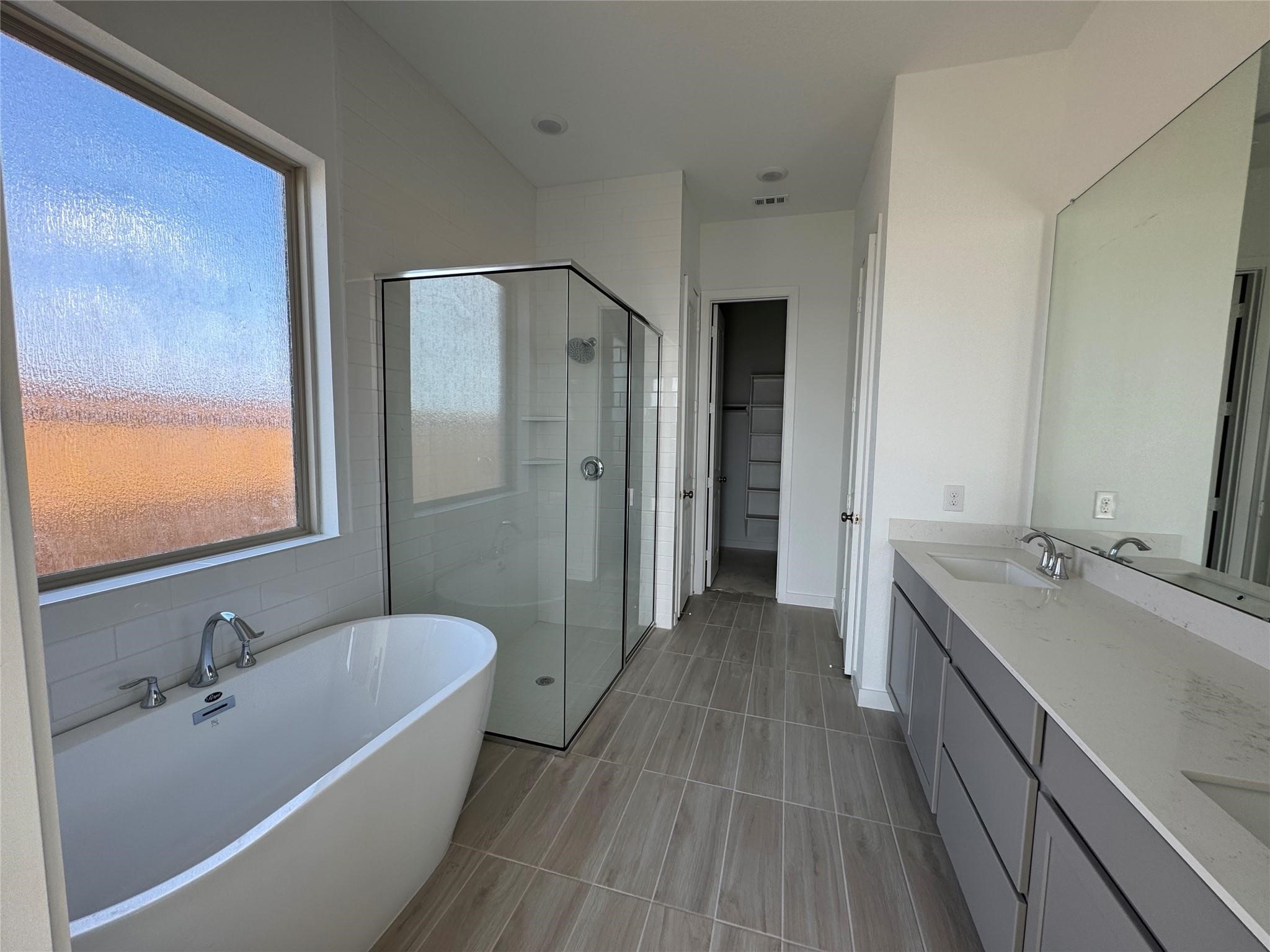 2719 Grove Crest Drive Rosenberg, TX 77469 - Photo 8 of 14 a bathroom with a tub sink and mirror