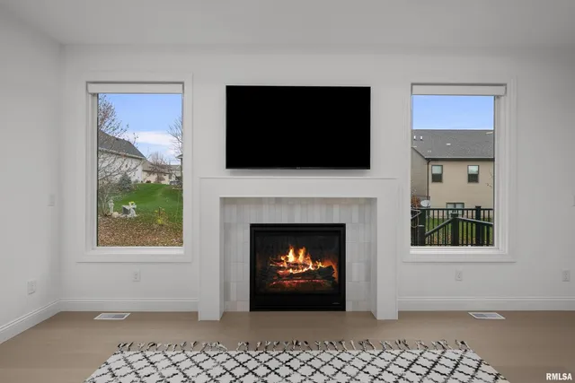 a large kitchen with stainless steel appliances kitchen island a large counter top and a stove