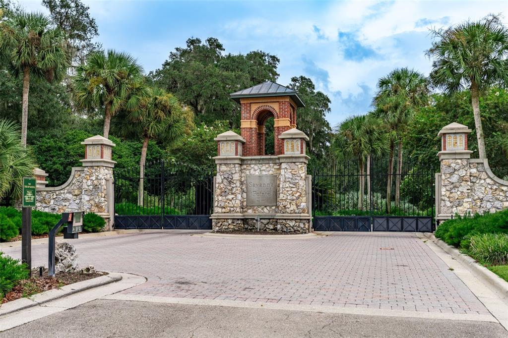 3897 Southwest 69th Avenue Gainesville, FL 32608 - Photo 19 of 20 a front view of a house with a garden and trees