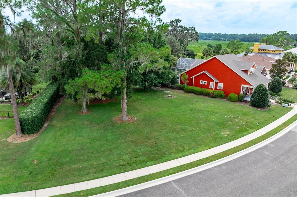 3897 Southwest 69th Avenue Gainesville, FL 32608 - Photo 2 of 20 a view of a garden with a house in the background